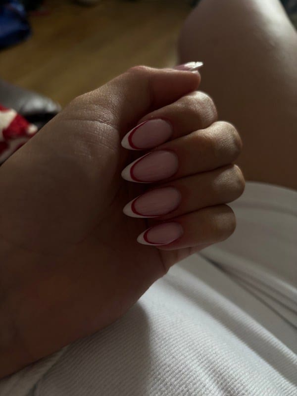 A natural almond BIAB set with a soft French tip by Abi